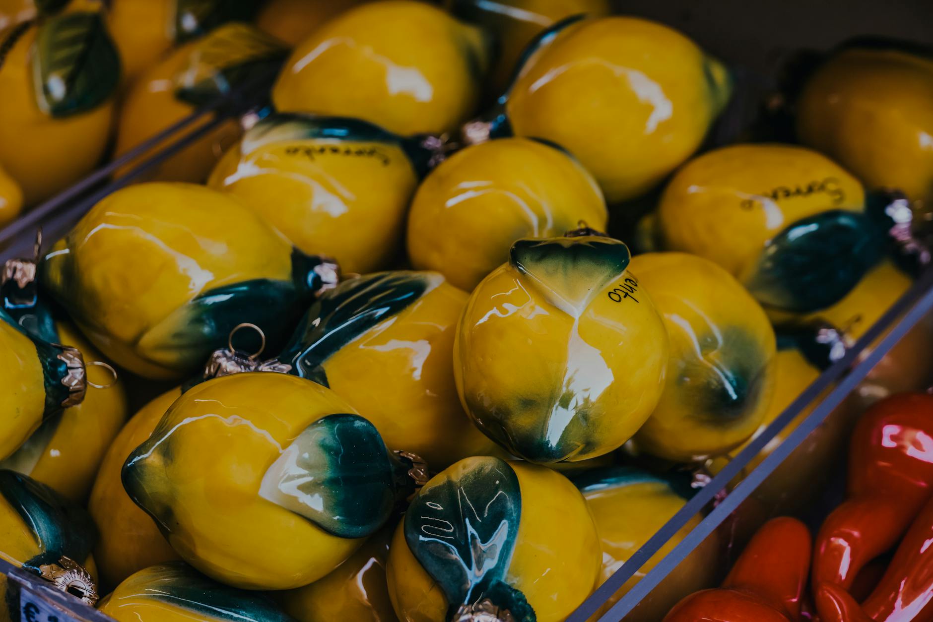 Yellow silicone lemon vibrator surrounded by peeled bananas on bright yellow background, symbolizing pleasure and self-care