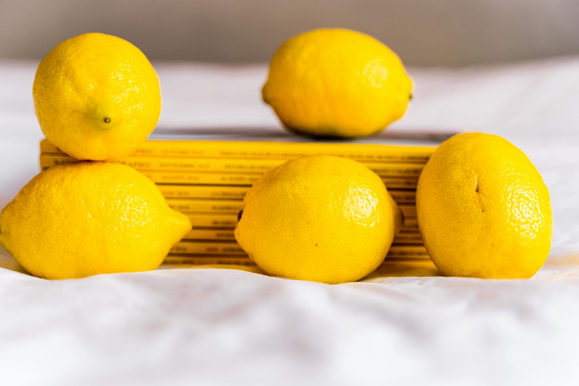 Bright yellow lemons on a pastel background, symbolizing freshness and sensation recovery